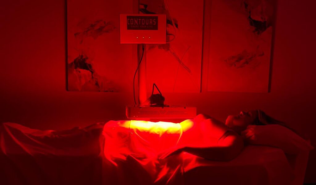 Woman undergoing UltraSlim® Red Light Treatment - Contours